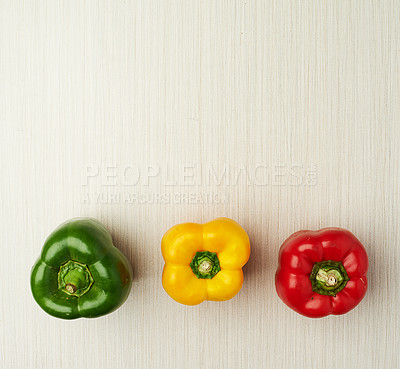 Buy stock photo Vegetables, nutrition and bell pepper on table top for wellness, health and diet in studio. Ingredients, green and red isolated for eating, food and weight loss in house for prepare and cook.