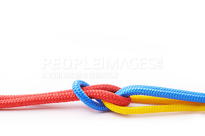 Buy stock photo Rope, teamwork and collaboration in white studio background for abstract, knot or connection. Security, cables or community thread together in business with color for diversity, inclusion or building