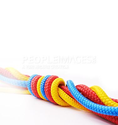 Buy stock photo Rope, color and knot together by white background for support with strong connection, collaboration and helping. String, colorful and tie in studio for cooperation with security, coil and partnership