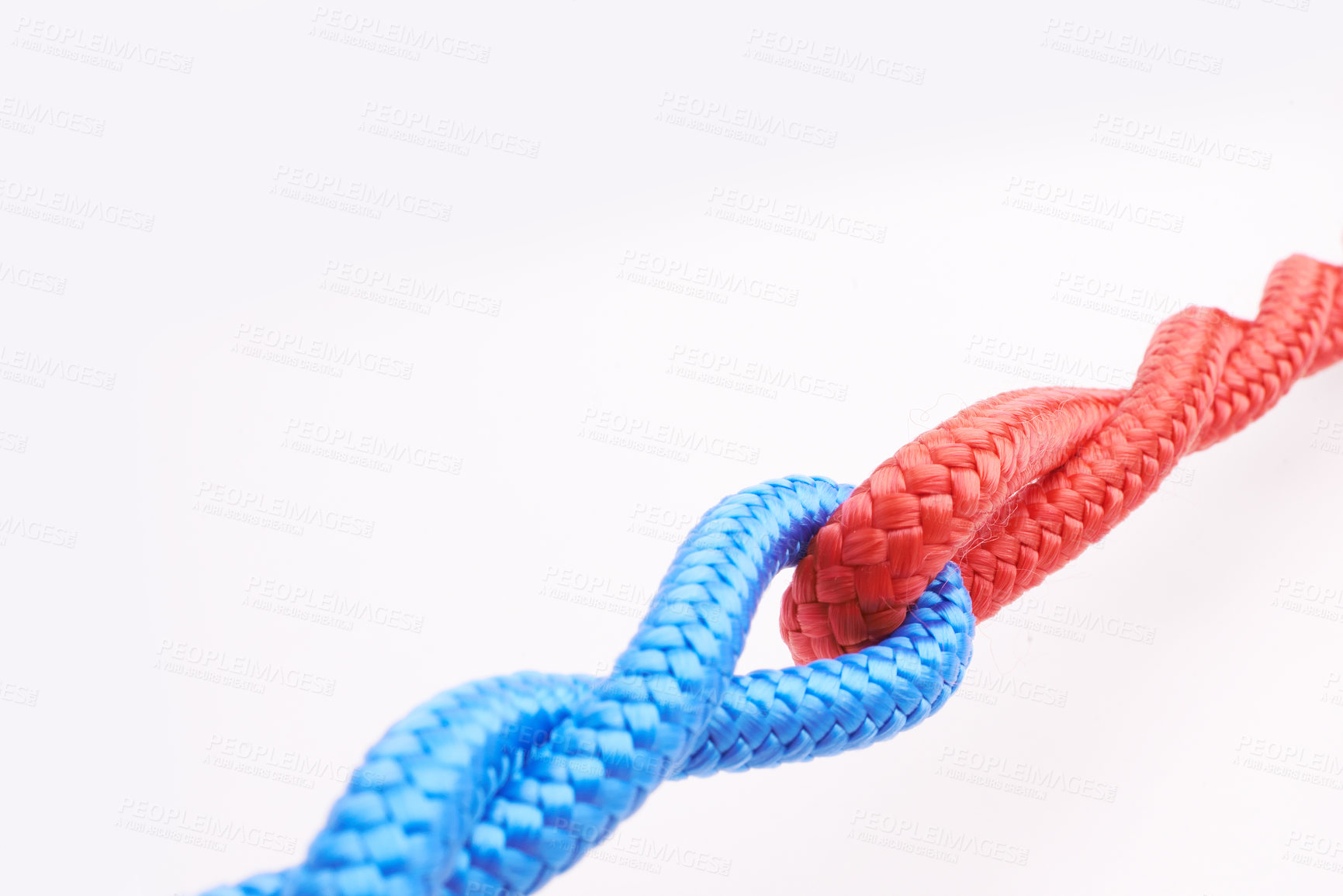 Buy stock photo Rope, ties and connection with color in knot, link or loop together on white background in collaboration. Blue, red and  join string in abstract unity with security from contact in chain or coil