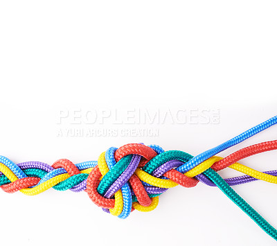 Buy stock photo Rope, ties and unity of color in knot or braid on white background in studio for solidarity. Security, cord and abstract connection of rainbow society with ties together in collaboration of community