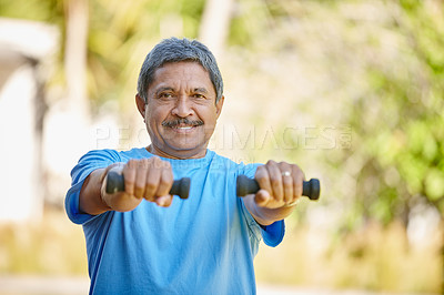Buy stock photo Portrait shot of a mature man lifting dumbbells outside