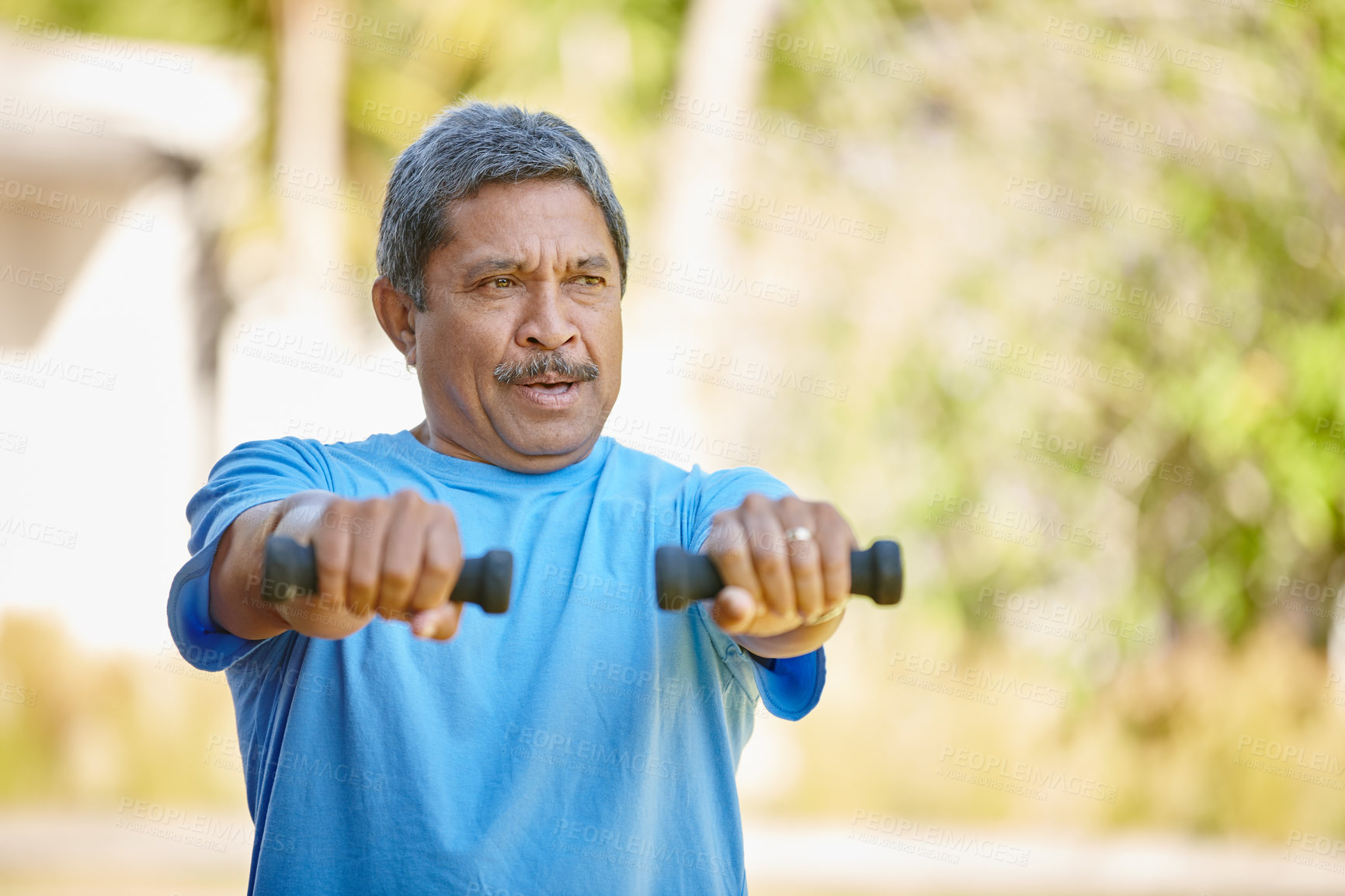 Buy stock photo Cropped shot of a mature man lifting dumbbells outside