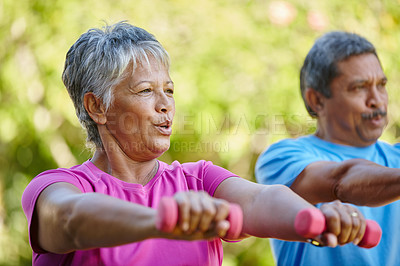 Buy stock photo Portrait of a mature couple exercising together in their backyard