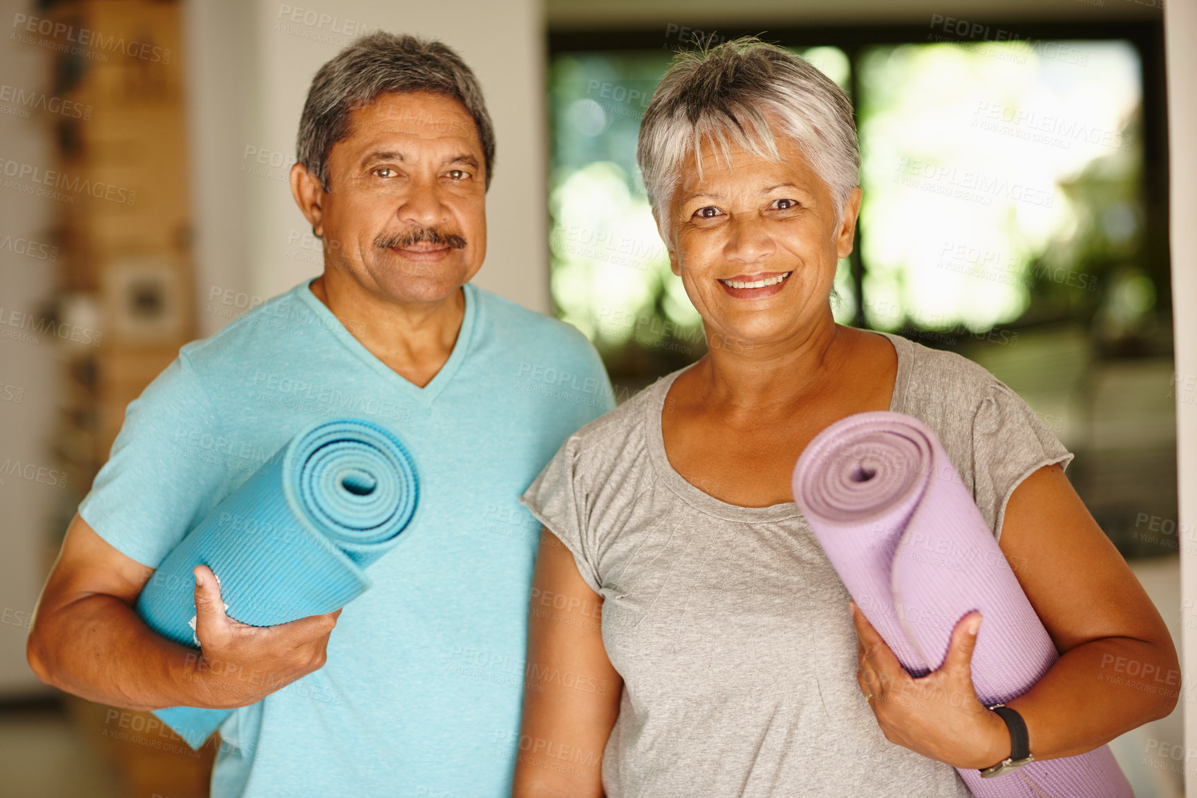 Buy stock photo Portrait of a mature couple holding yoga mats