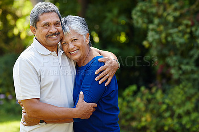 Buy stock photo Shot of a loving senior couple enjoying quality time together outdoors