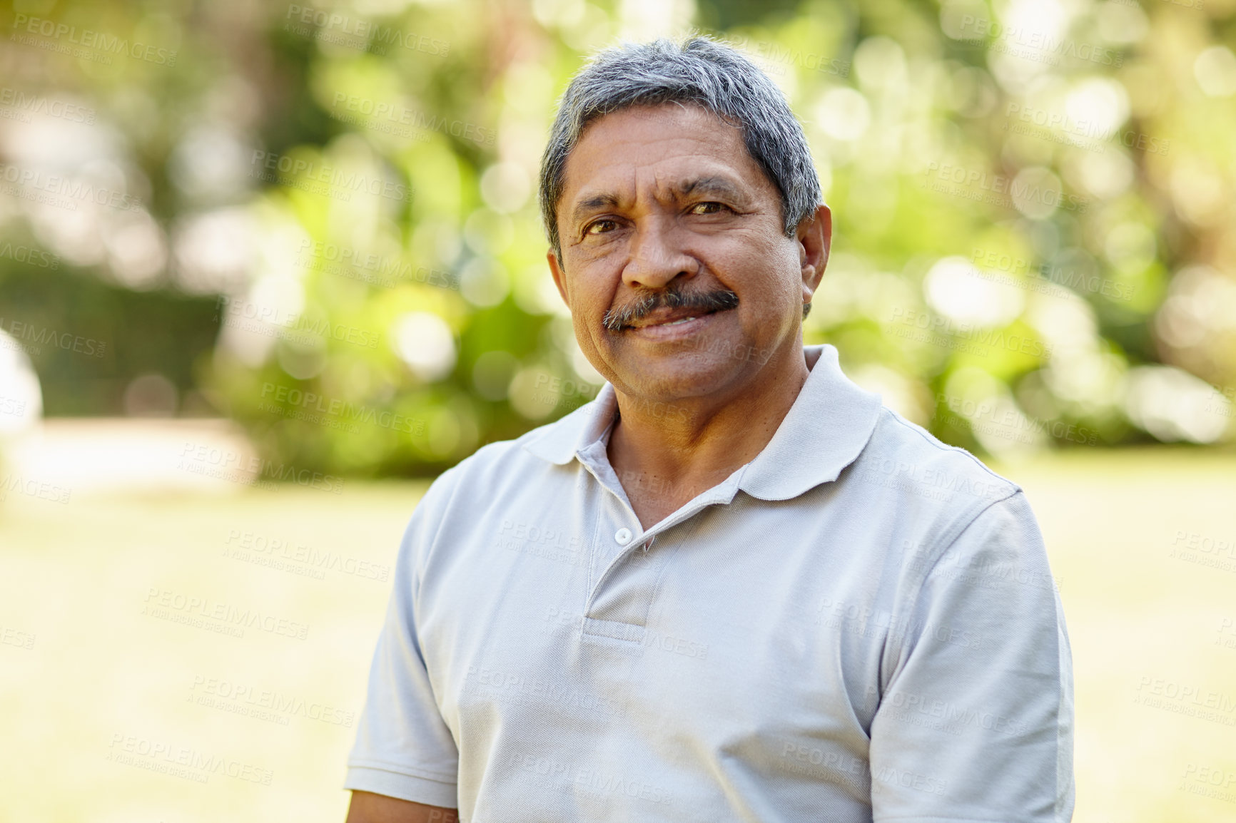 Buy stock photo Portrait of a happy senior man enjoying a day outdoors