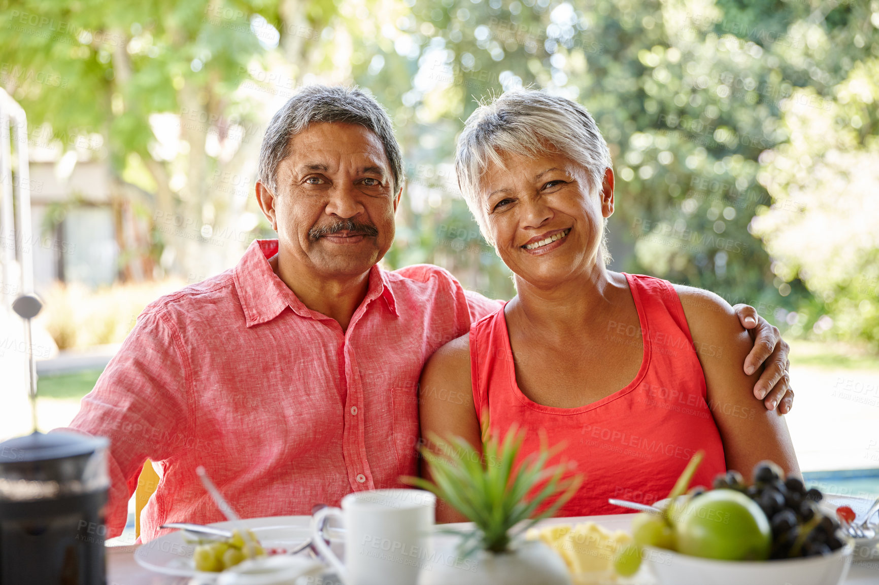 Buy stock photo Shot of a happy senior couple enjoying a leisurely breakfast together at home