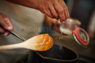 Buy stock photo Closeup shot of two people cooking a meal together at home