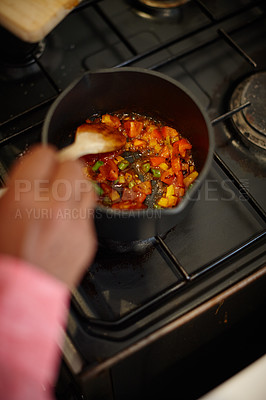 Buy stock photo Cropped shot of a man cooking a mixture of chopped vegetables on the stove