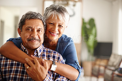 Buy stock photo Shot of a loving senior couple enjoying quality time together at home