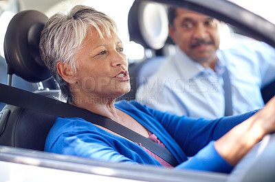 Buy stock photo Shot of a senior couple going for a drive together in a car