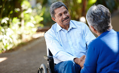 Buy stock photo Cropped shot of a senior couple talking outdoors