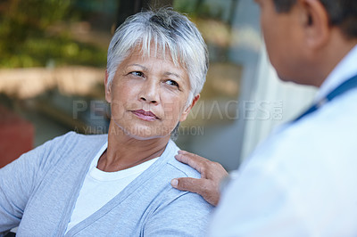 Buy stock photo Cropped shot of a senior woman listening to her doctor