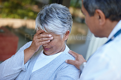 Buy stock photo Cropped shot of a senior woman with her doctor