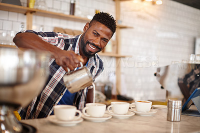 Buy stock photo Cropped portrait of a handsome male barista preparing coffee for his customers