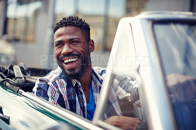 Buy stock photo A handsome young man driving in his convertible