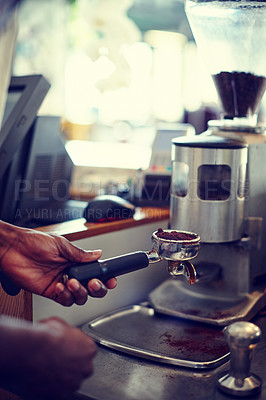 Buy stock photo Shot of a barista preparing grind coffee for brewing