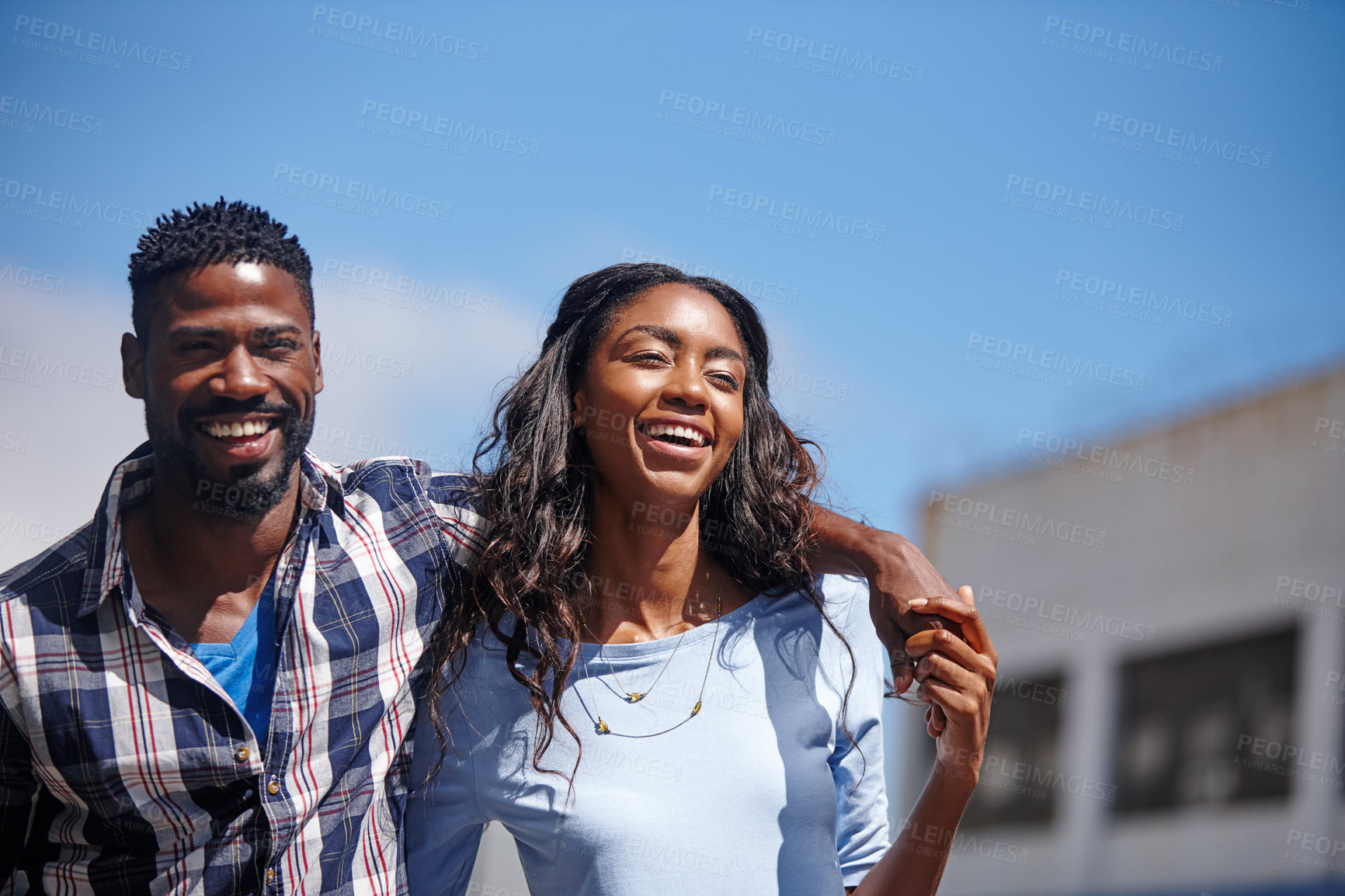 Buy stock photo Shot of an affectionate couple walking outdoors