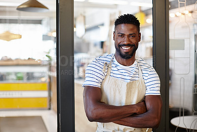Buy stock photo Portrait of a handsome young man standing at the entrance to his coffee shop