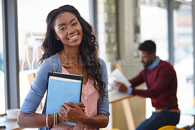 Buy stock photo A portrait of an attractive woman using a digital tablet at a coffee shop