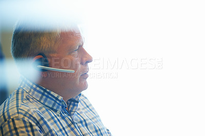Buy stock photo Businessman, face and headphones at call center for customer service, telemarketing or support at office. Mature man, consultant or agent ready for online advice or help on mockup space at workplace