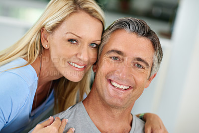 Buy stock photo Portrait of a smiling mature couple at home