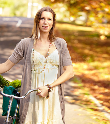 Buy stock photo Shot of an attractive young woman in the park on an autumn day