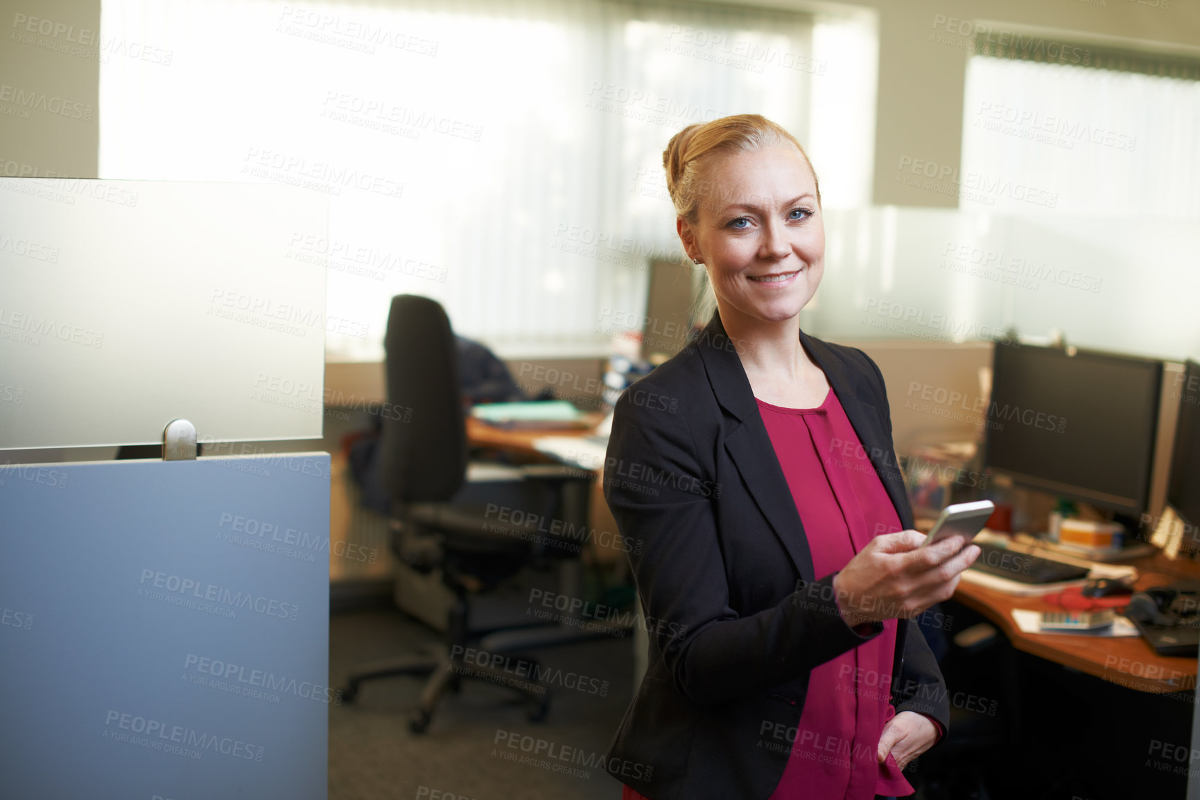 Buy stock photo Portrait of an attractive businesswoman using he cellphone in the office