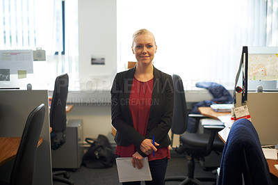 Buy stock photo Portrait of an attractive businesswoman holding paperwork in the office