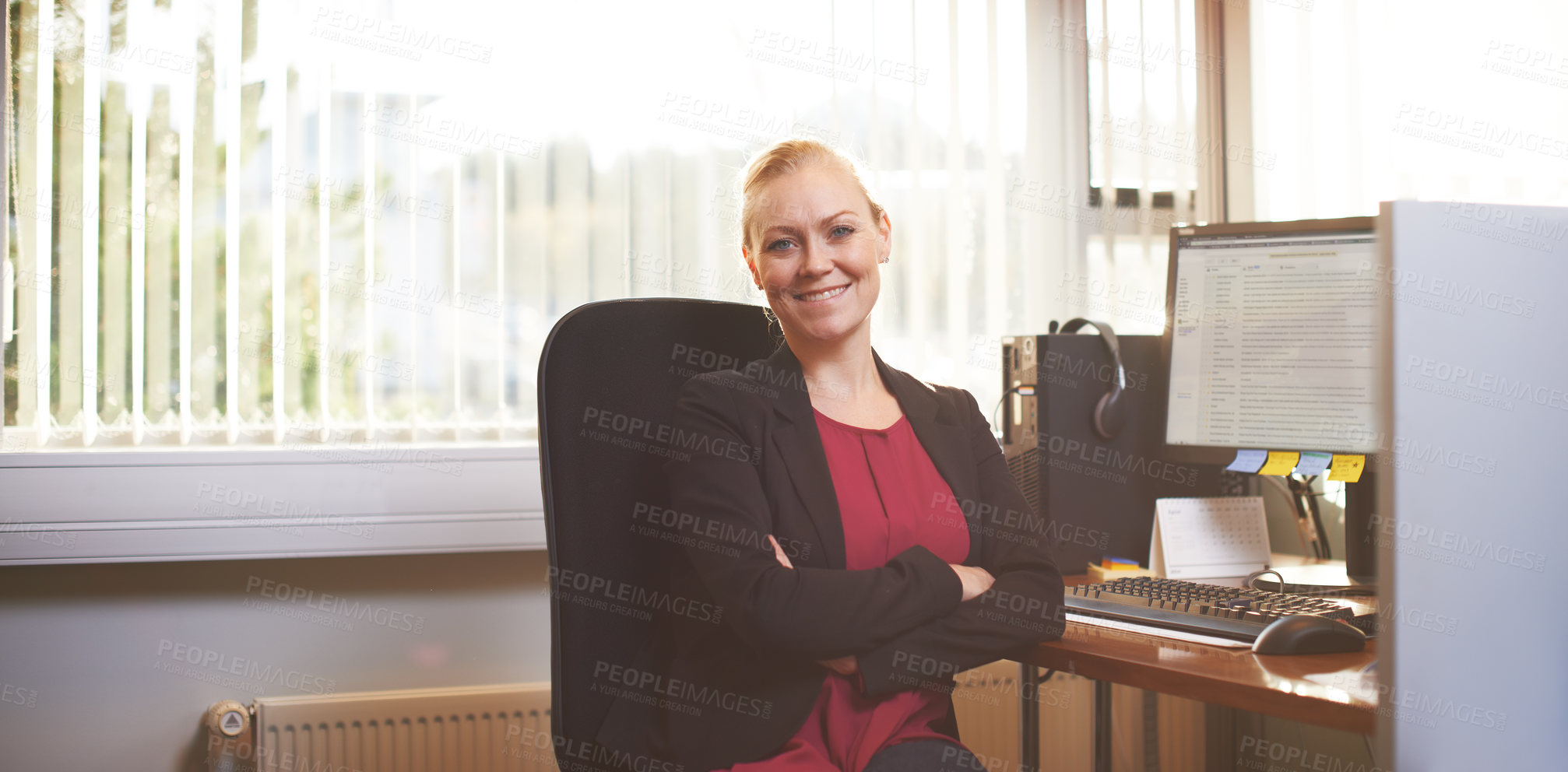 Buy stock photo Portrait of an attractive businesswoman sitting with her arms crossed in the office