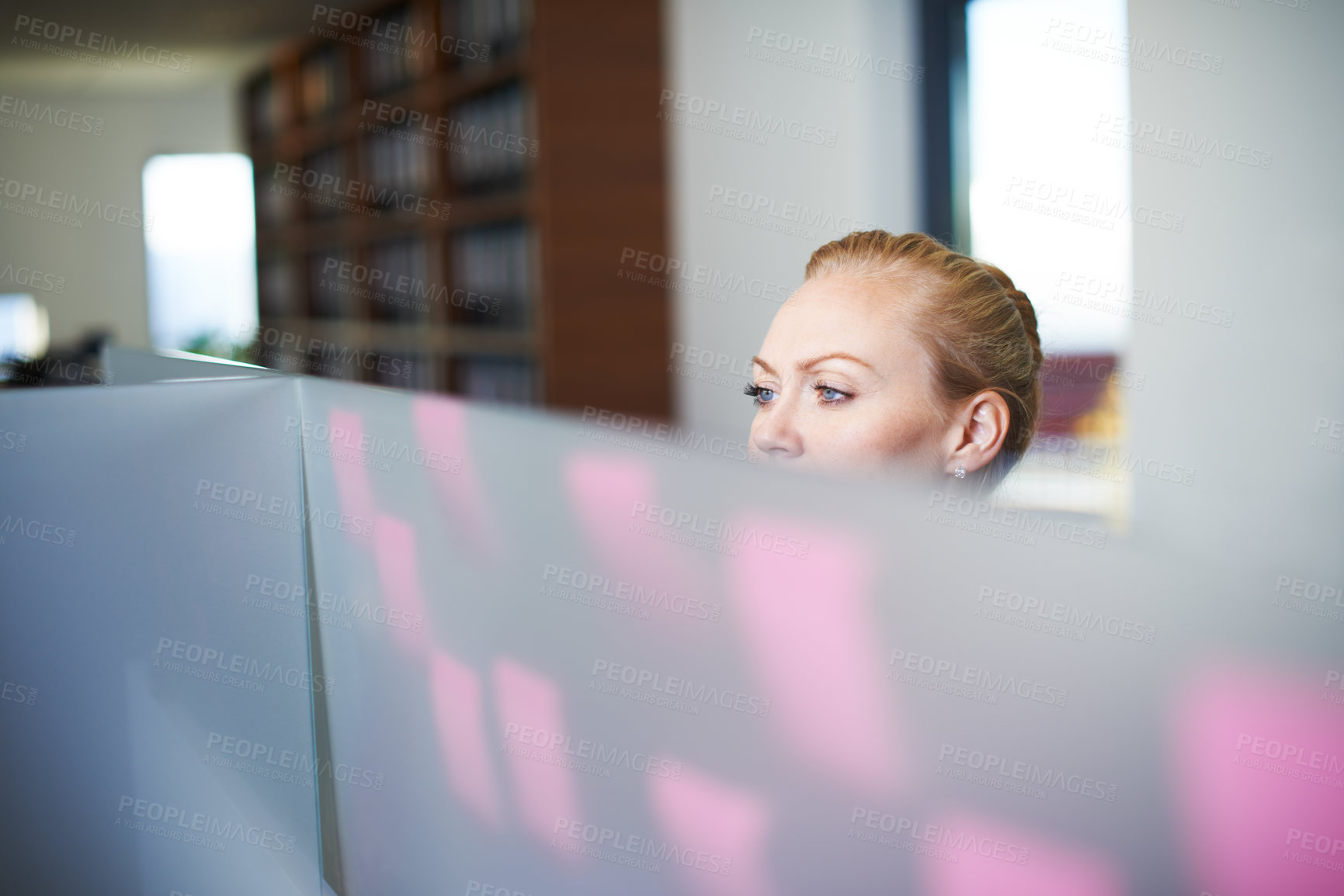 Buy stock photo Cropped shot of an attractive businesswoman checking the tasks on the sticky note board