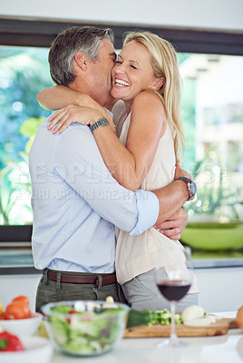 Buy stock photo Mature couple, hug or cooking in kitchen for dinner preparation, anniversary or support. Man, happy woman and excited in home for milestone celebration, healthy meal and love or affection in marriage