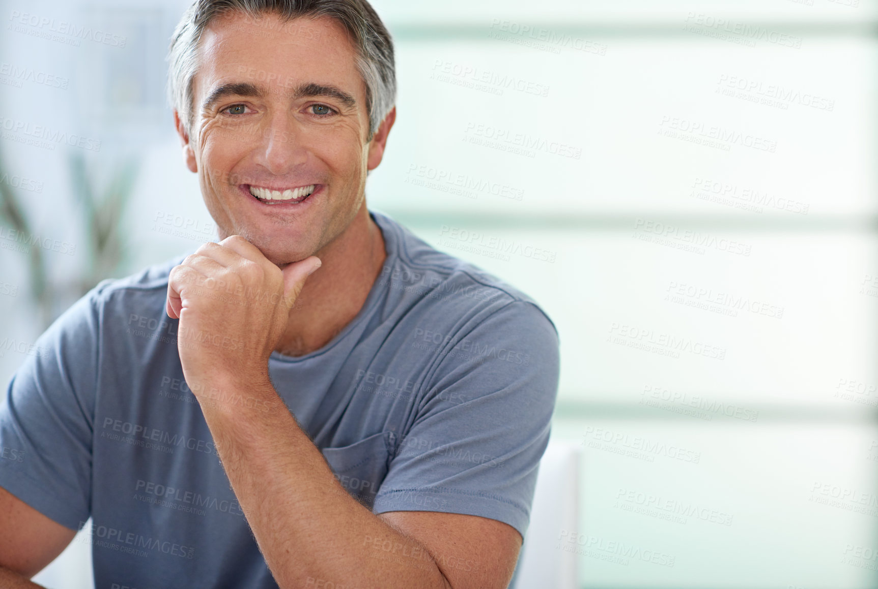 Buy stock photo Cropped shot of a handsome mature man relaxing at home