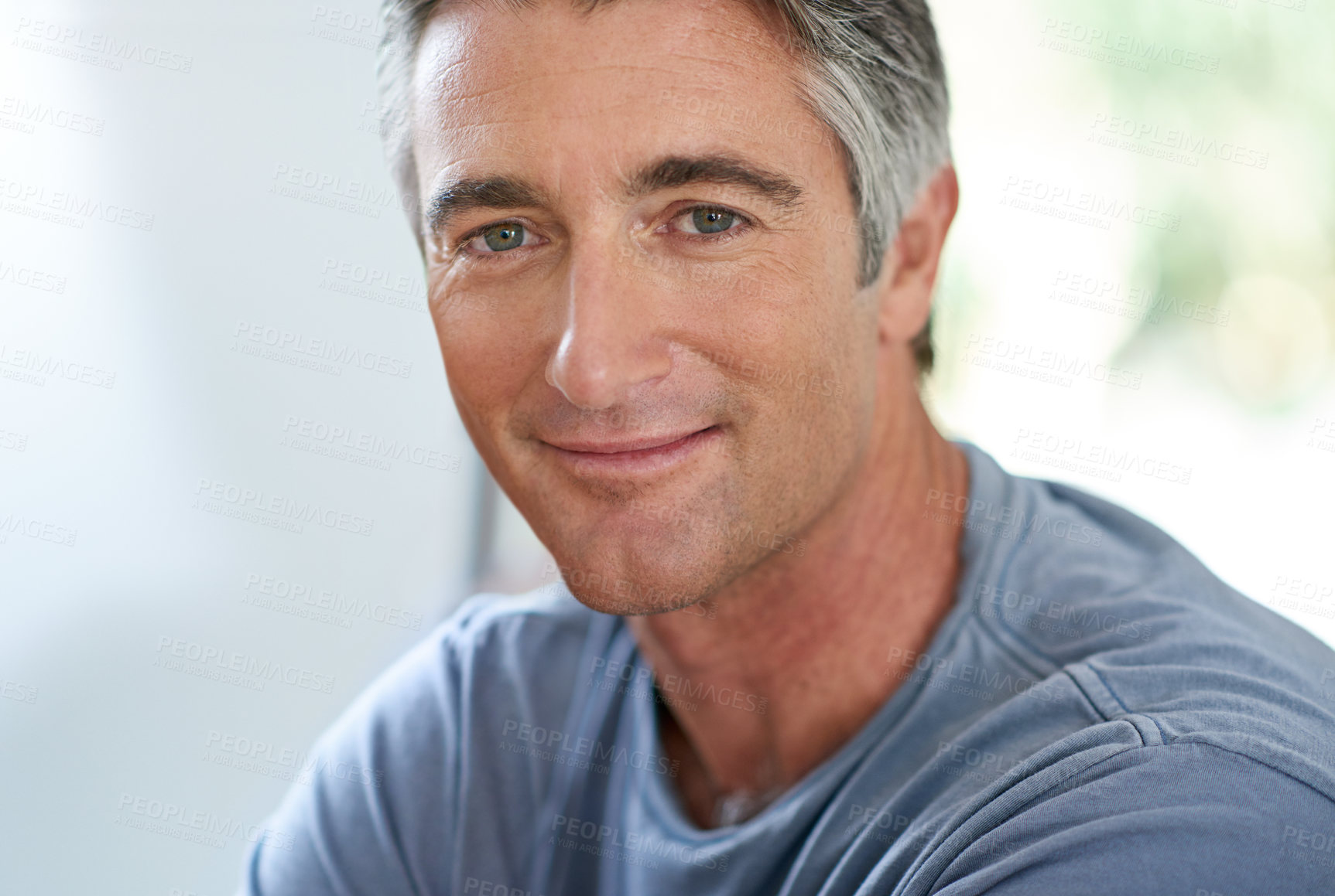 Buy stock photo Cropped shot of a handsome mature man relaxing at home