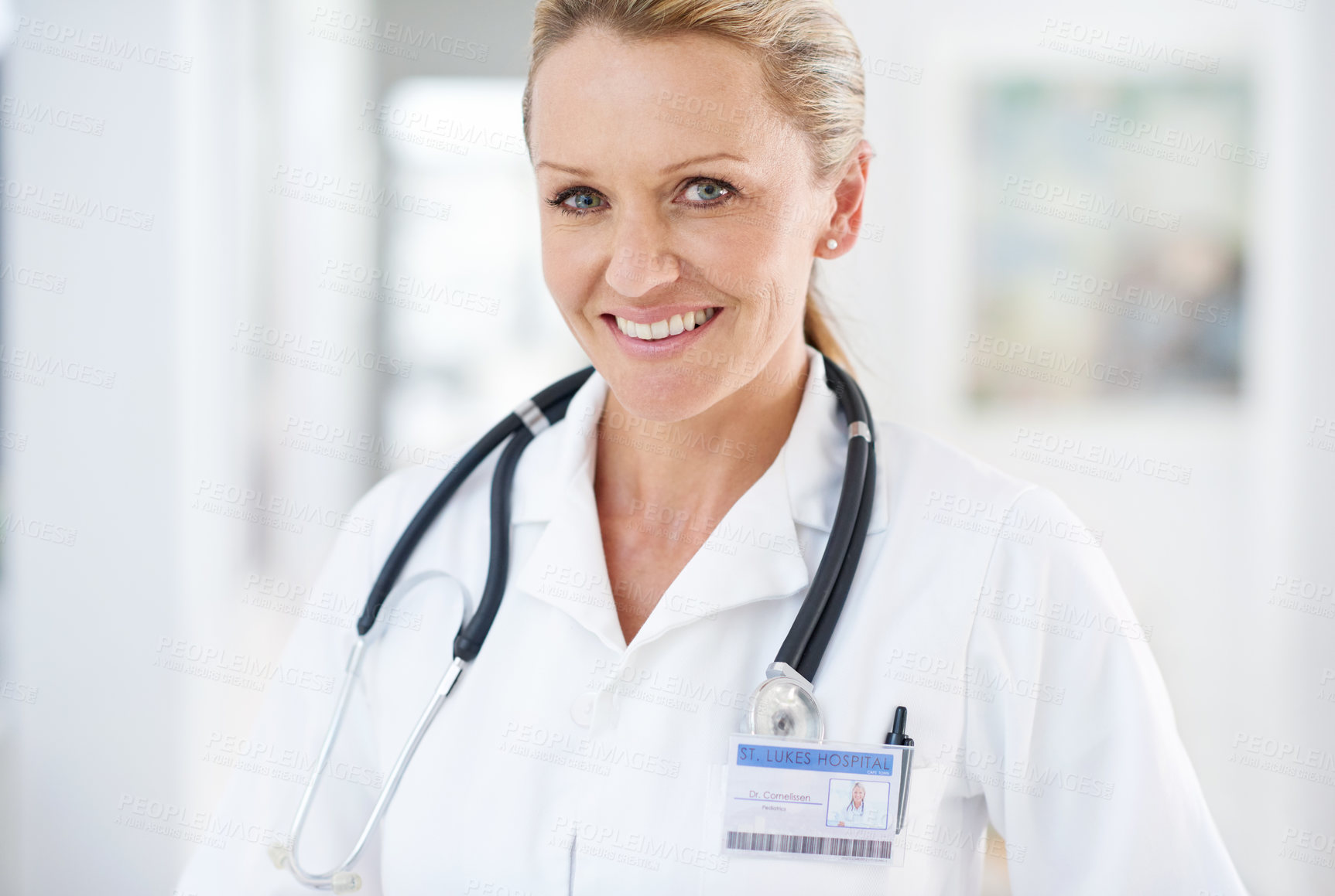 Buy stock photo Mature woman, doctor and portrait with hospital, healthcare and clinic professional with confidence. Cardiology, stethoscope and wellness worker with happy and smile at ICU care job as surgeon