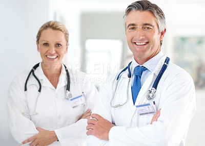 Buy stock photo Portrait of two doctors standing in a hospital corridor