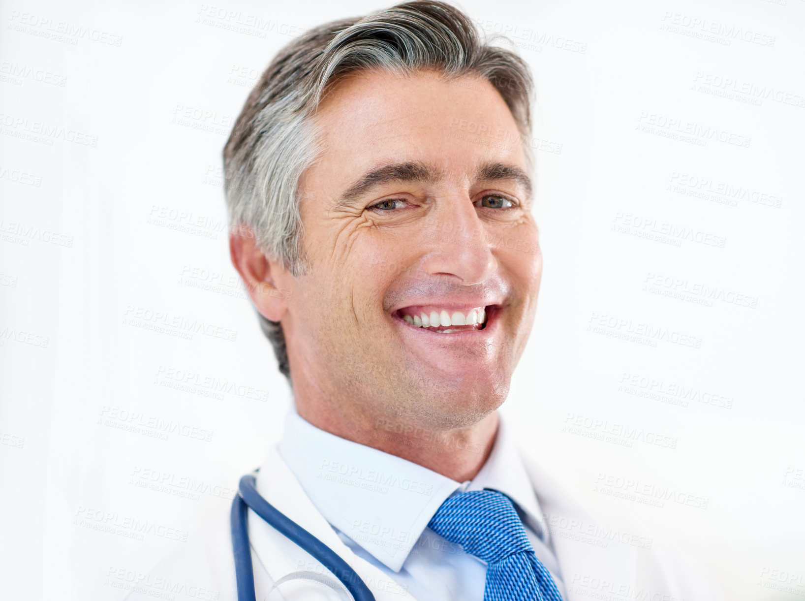 Buy stock photo Happy, doctor and portrait of man in hospital with stethoscope for medical service, career and consulting. Professional, healthcare and person with equipment for cardiology, medicine and wellness