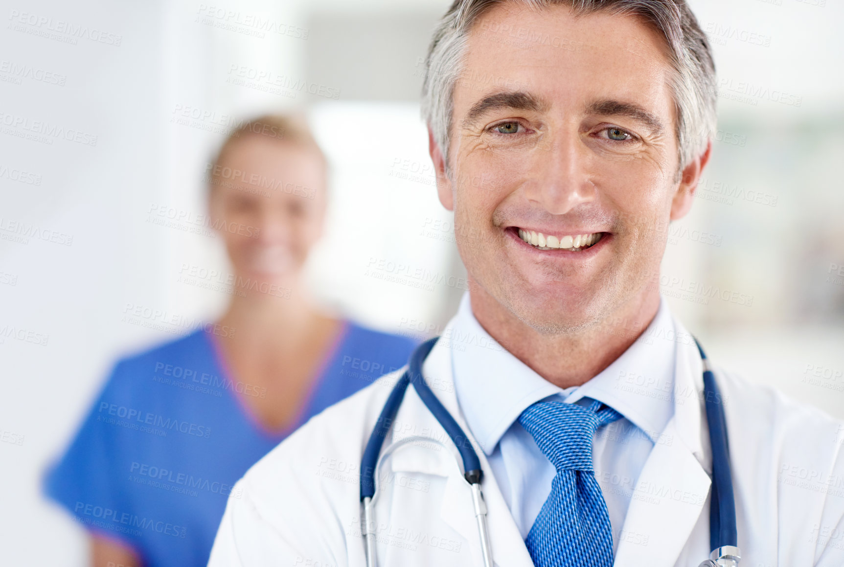 Buy stock photo Hospital, happy doctor and portrait of man with nurse for medical equipment, career and consulting. Professional, healthcare and person with stethoscope for cardiology service, medicine and wellness