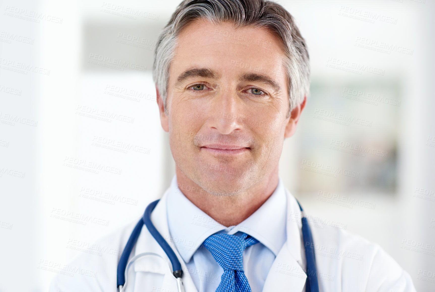 Buy stock photo Portrait of a doctor standing in a hospital corridor