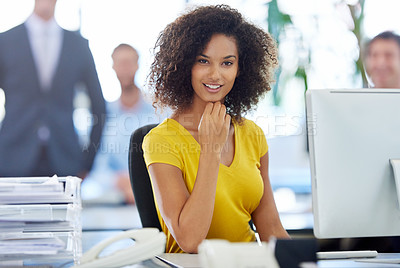 Buy stock photo Portrait of an attractive young businesswoman working at her office desk