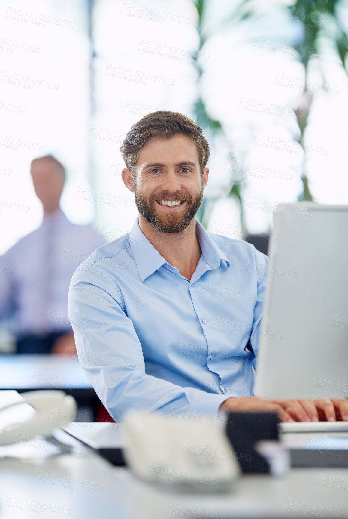Buy stock photo Cropped shot of a handsome young businessman in the office