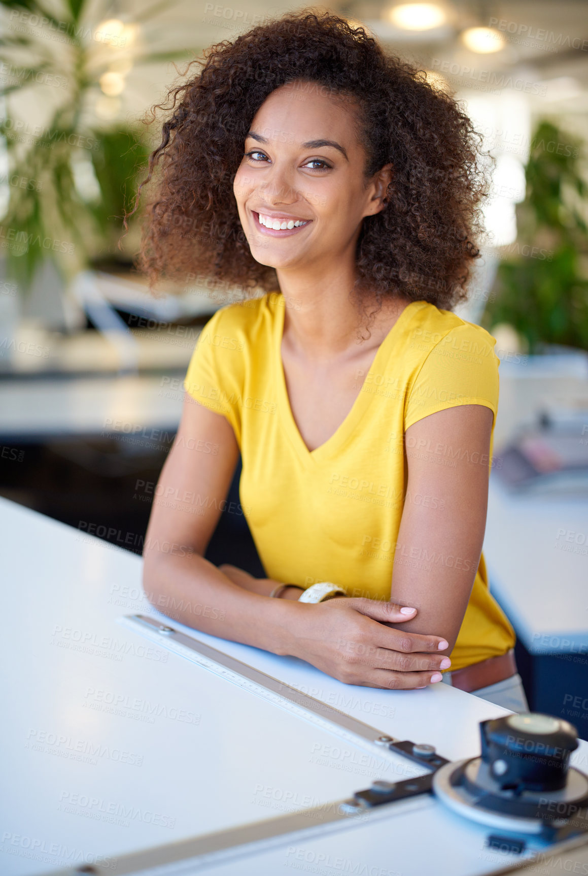 Buy stock photo Cropped portrait of a young female designer sitting at her office desk