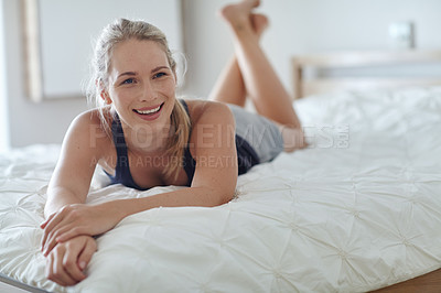 Buy stock photo Shot of an attractive young woman relaxing at home