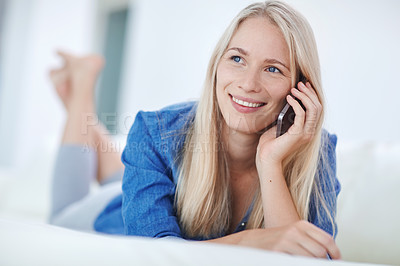 Buy stock photo Shot of an attractive young woman relaxing at home