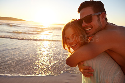 Buy stock photo Cropped shot of a young couple on the beach