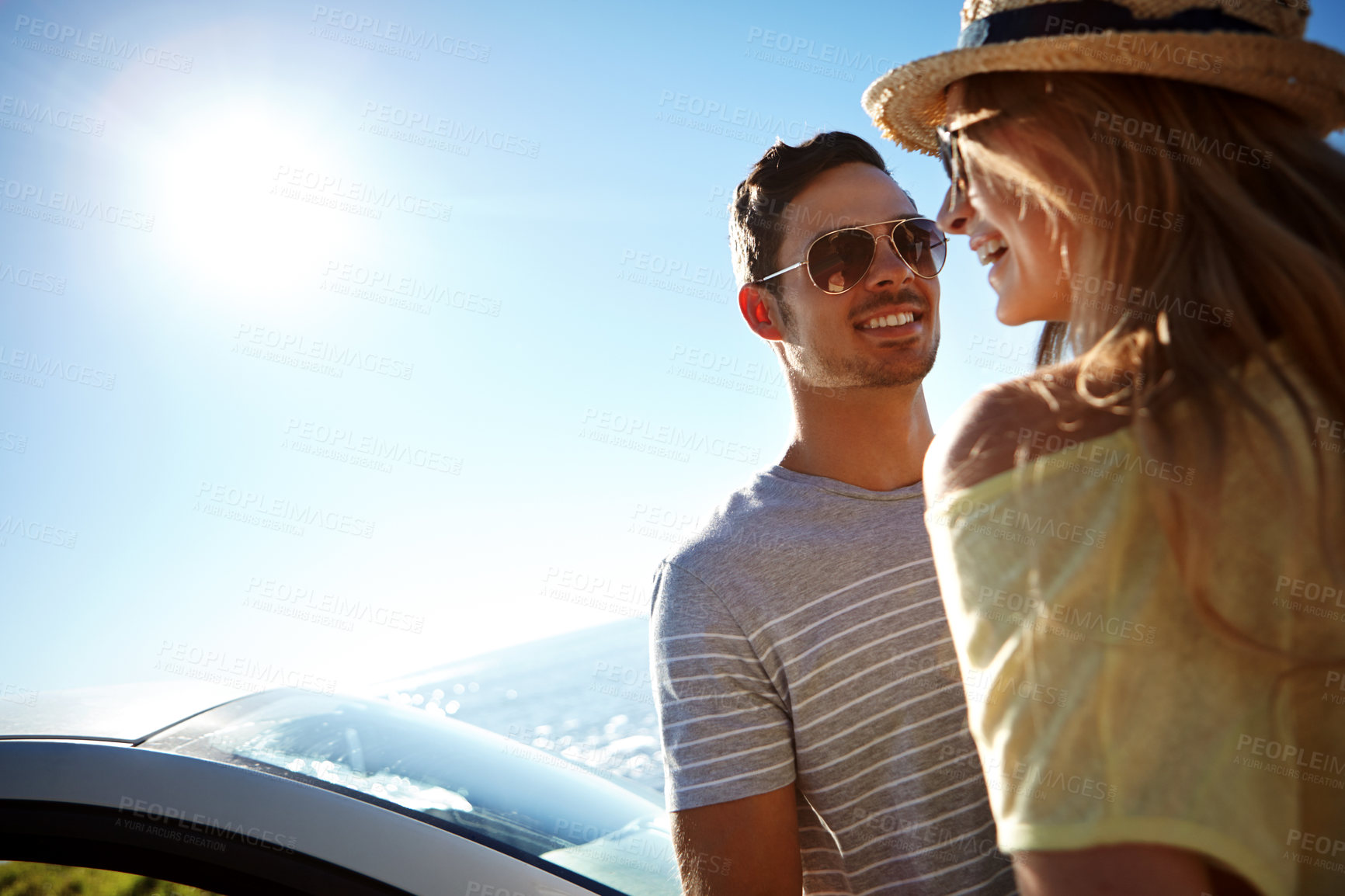 Buy stock photo Happy, couple and road trip with car, outdoor and together on summer vacation, adventure or journey. Love, man and bonding with woman in nature, sunshine and travel with vehicle  and mockup space