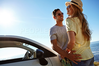 Buy stock photo Cropped shot of an affectionate young couple on a roadtrip