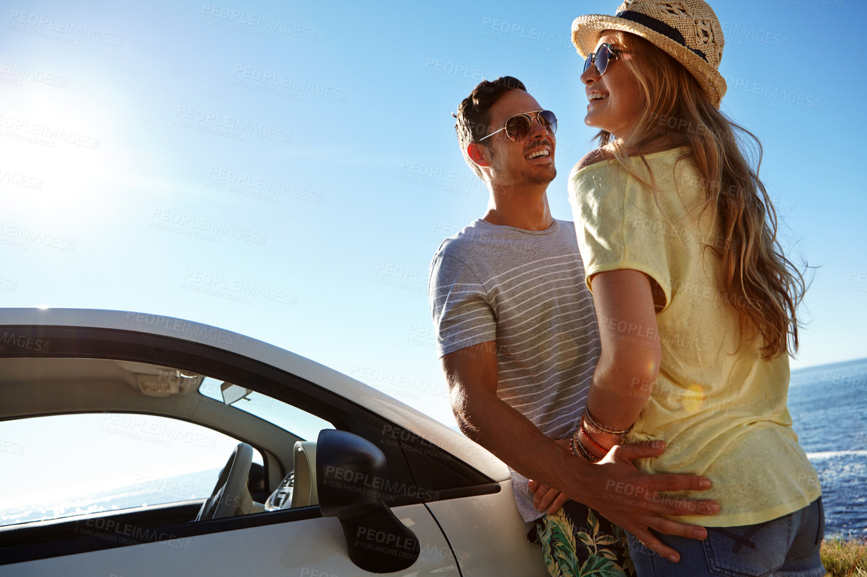 Buy stock photo Cropped shot of an affectionate young couple on a roadtrip