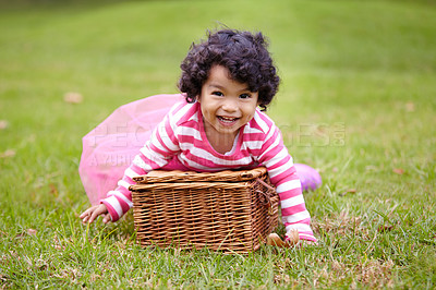 Buy stock photo Portrait, happy child and basket for picnic in park with laugh, smile and fun. Girl. curly hair and natural in pink tutu for imagine, game or whimsical activity for growth, wellness or development